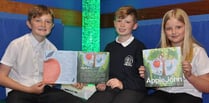 Children delighted by autumnal tale of John and the apple tree