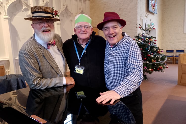 L to R: John Platt, Bryan Tucker Totnes Caring volunteer and local pianist Tom Unwin