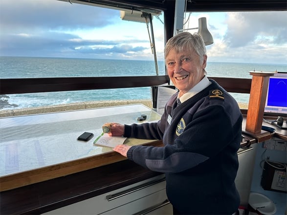 Helen at St Ives NCI station stamping the Coast Path Passport