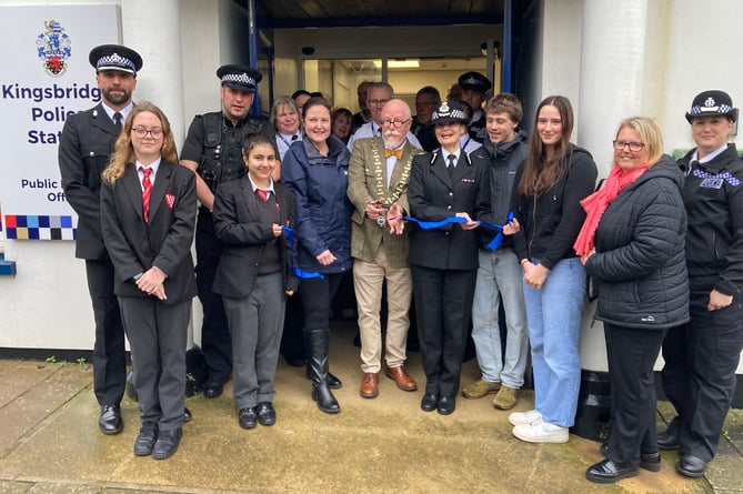 Kingsbridge Mayor Cllr Philip Cole cuts the ribbon watcherd by Police and Crime Commissioner Alison Hernandez and others this morning