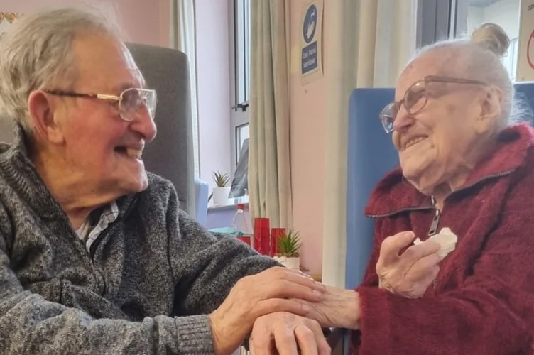 William and Sheila Glass, 94 and 96 respectively, are reunited during a hospital visit. A couple in their 90s who have rarely ever been apart have been separated in a "heartbreaking nightmare" - due to housing shortages. Sheila Glass, 96, and her husband of 74 years, William Glass, 94, have been forced to part because of a shortage of housing and care options means Sheila is unable to leave hospital - despite her being medically fit to go home. Sheila broke her neck during a fall at her home  and was sent to Liskeard Hospital, in Cornwall. But even though she was declared medically fit to leave 60 days ago, Sheila cannot leave hospital, as the home the pair shared in Millbrook was declared unsafe by occupational therapists.