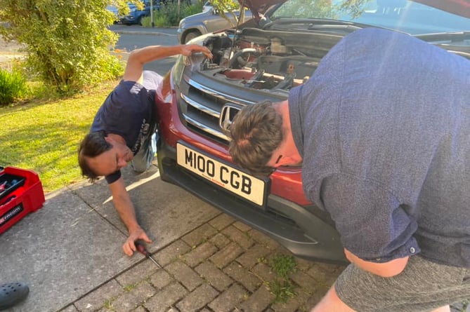 Mechanics Dave and Aidan beavered away for an hour to free the bird of prey