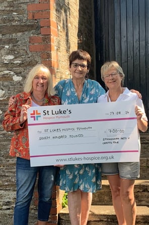 Committee members:Carol Gameson- Hughes, Jan Clarke and Jo Wells handing
 over the £700 cheque to St Luke’s Hospice.
