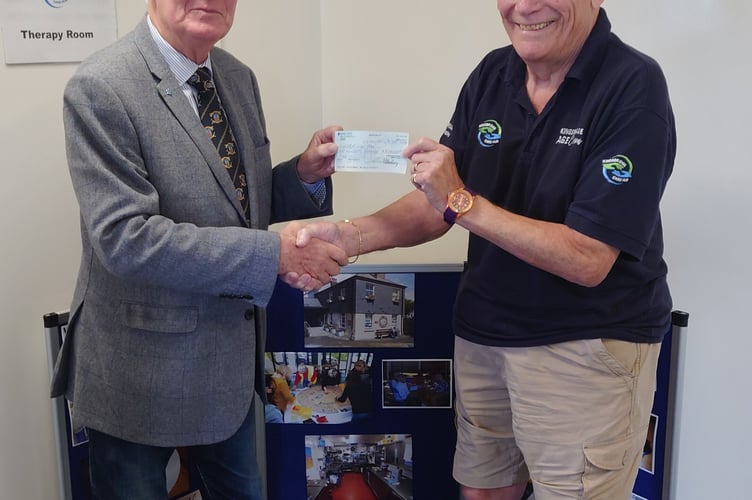 Graham Smith receiving the donation from Duncombe Lodge