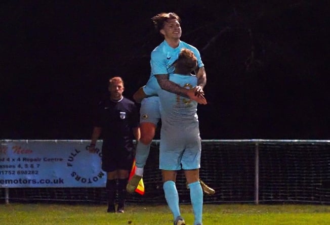 Ivybridge Town celebrate one of their two goals against St. Austell