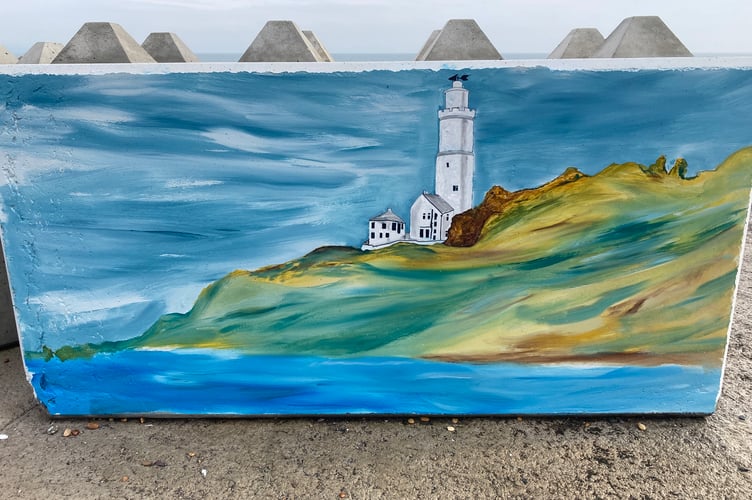 The panel featuring Start Point Lighthouse