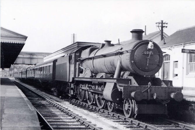 Engine number 6965 *Thirlestaine Hall* with a train from Kingswear at Paignton. 1960