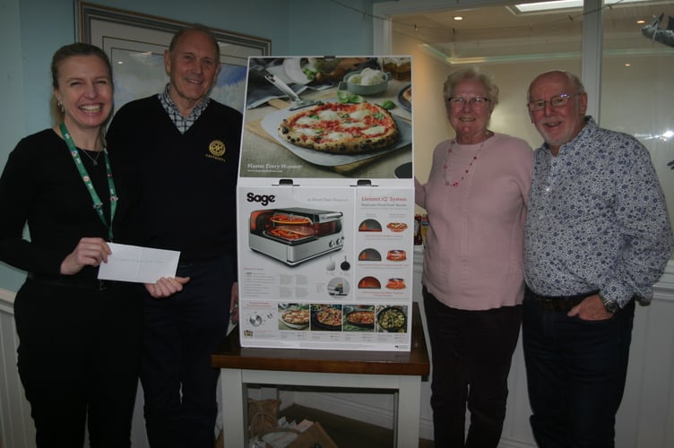 Hospice representatives Daniela Hopkins (left) and Sue Tweed  with Dartmouth Rotarians Bernard Young and Keith Barker (right).